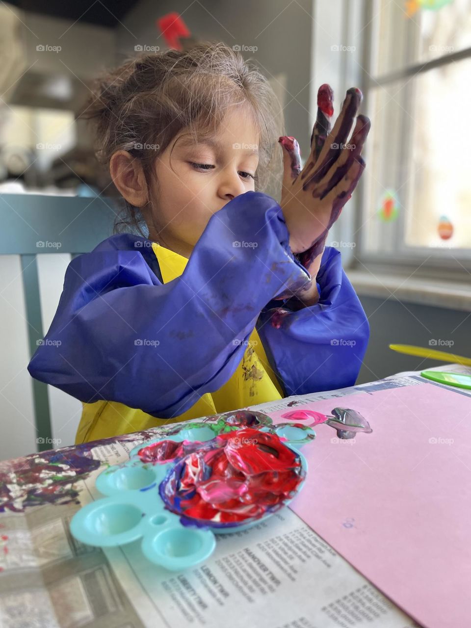 Messy little artist, toddler girl uses finger paints, toddler paints with hands, toddler makes a mess with paint, crafting with toddlers 