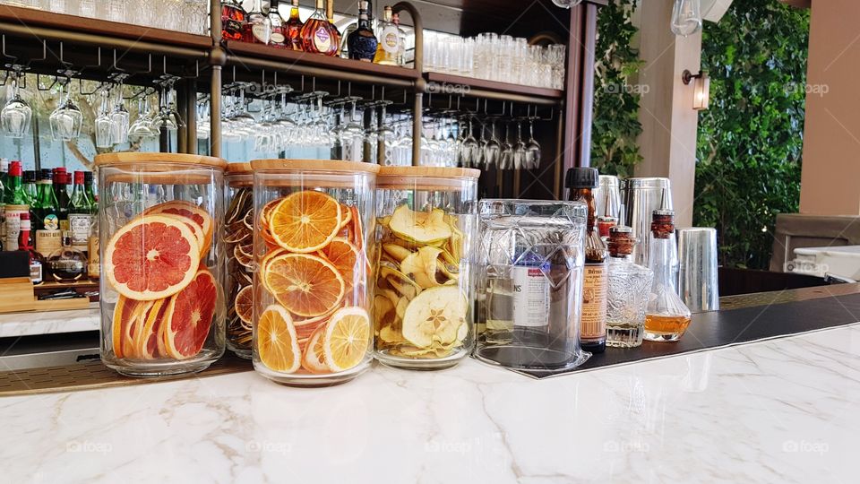 Jars with dried citrus at the bar