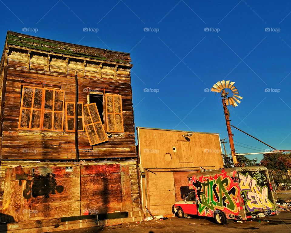 Dilapidated Old West Scene. Run Down Building In Urban Old West During Golden Hour
