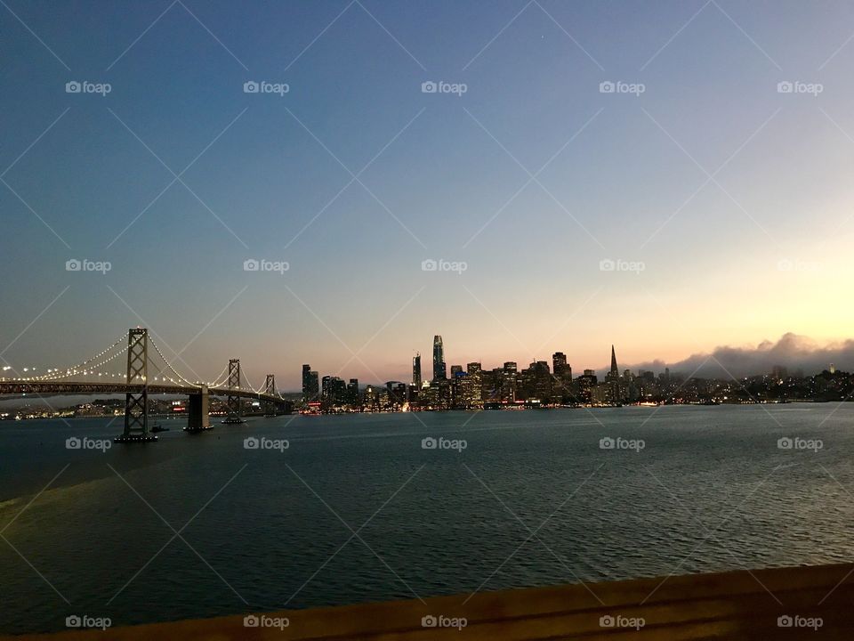 San Fransisco at sunset with Bay Bridge in sight. 