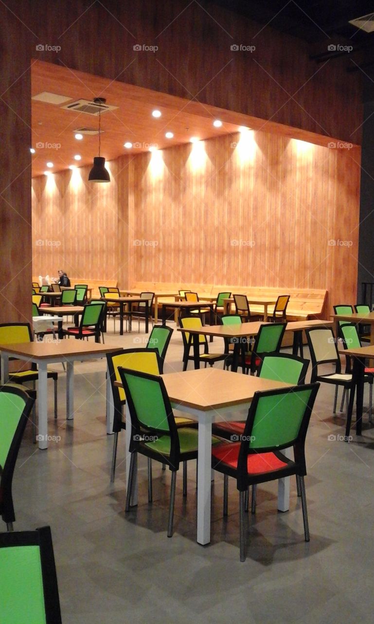 The tables, the chairs and green colour
