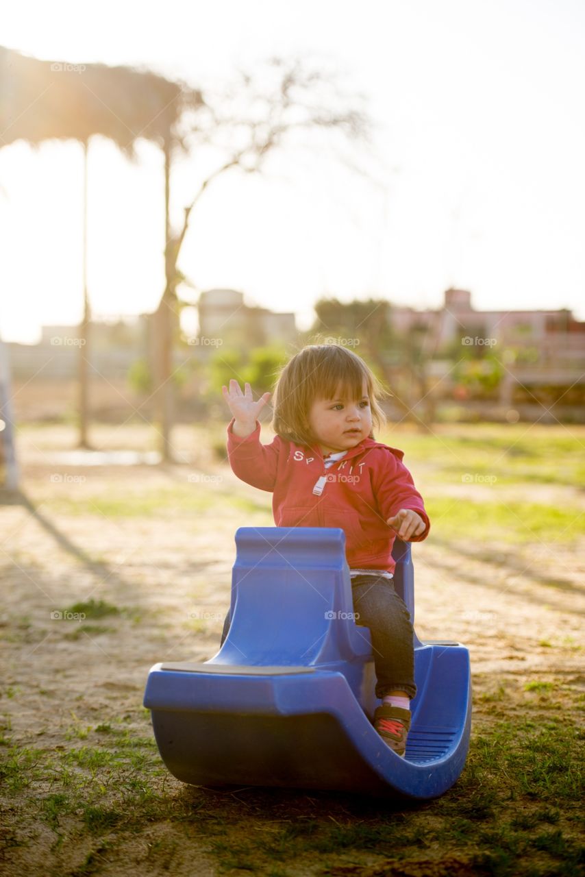 baby girl playing in a play ground