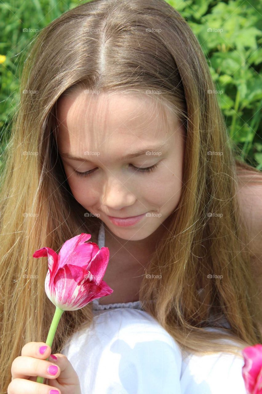 Girl picking tulips. Happy to do what you want. Enjoy life the way you want it.