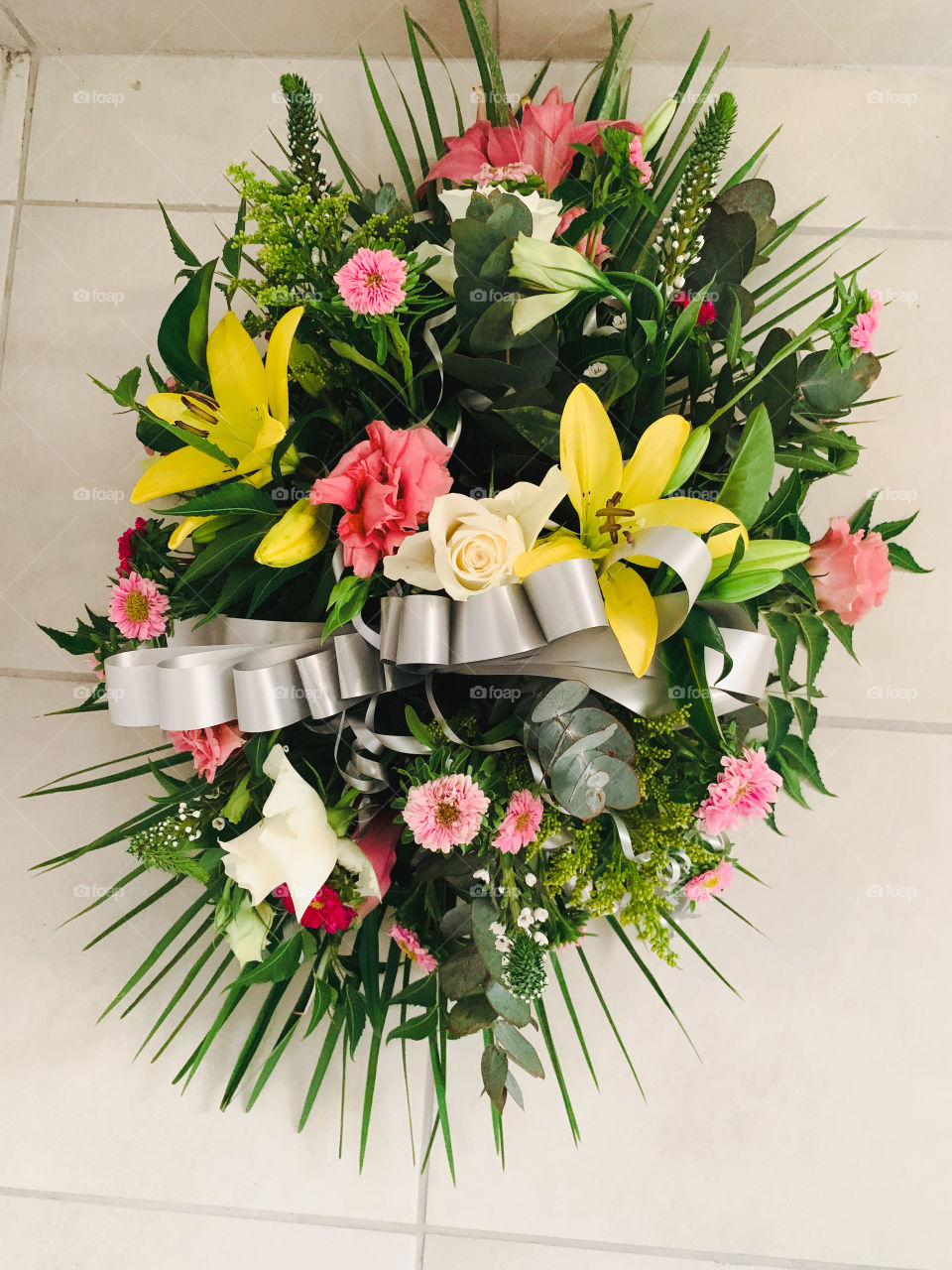 A bouquet of multicolored mourning flowers for the tomb. 