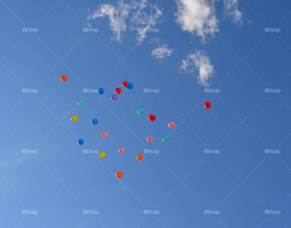 colour balloons in the blue sky clouds