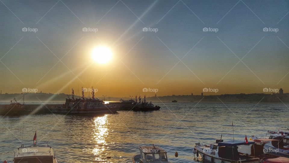 boats moored in istambul. bosforo coast at sunset With boats moored