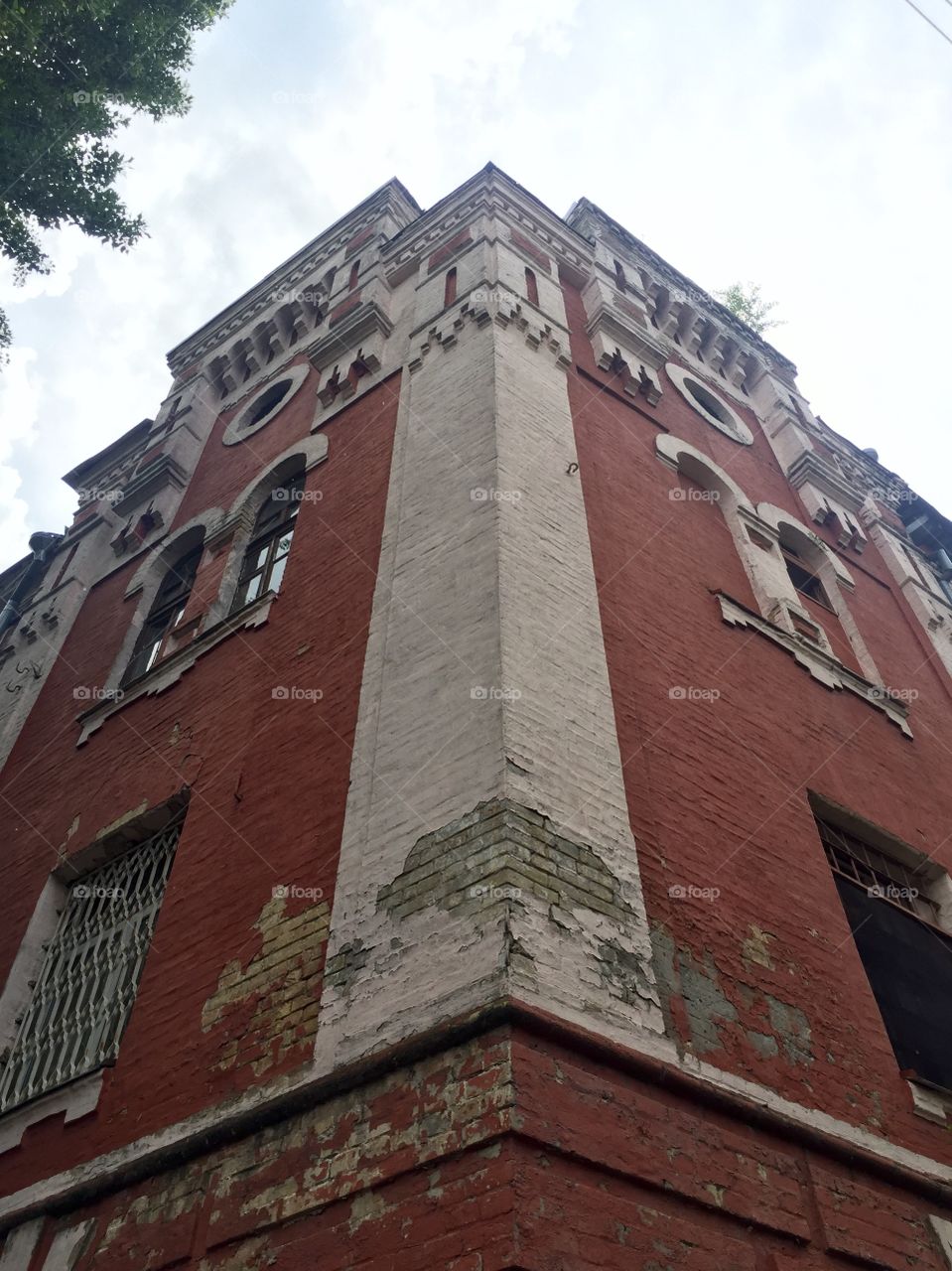 Corner of an old work in red and white