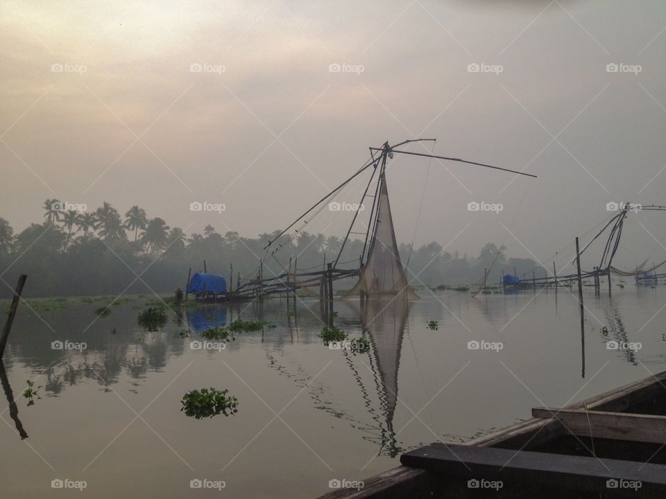Reflections on the water of the fishing nets ..