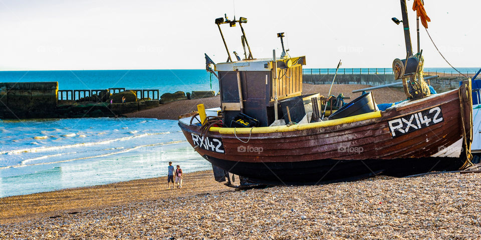 Fishing boat RX142 sits on Hastings fisherman’s beach ahead of the old harbour arm