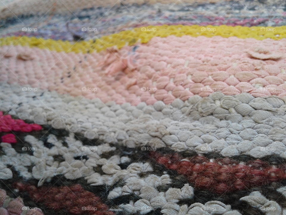 an old tapie weaved by women hands in morroco, i took this picture in a very isolated land in the countrie, it explaine how simple are this people