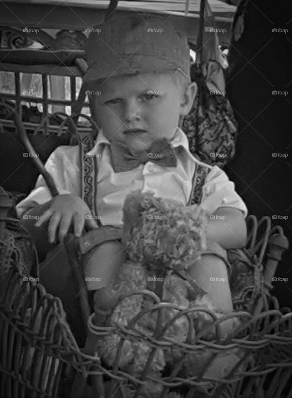 Boy sitting in basket