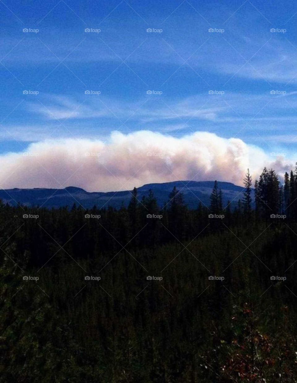 explosion on cloud behind the mountain