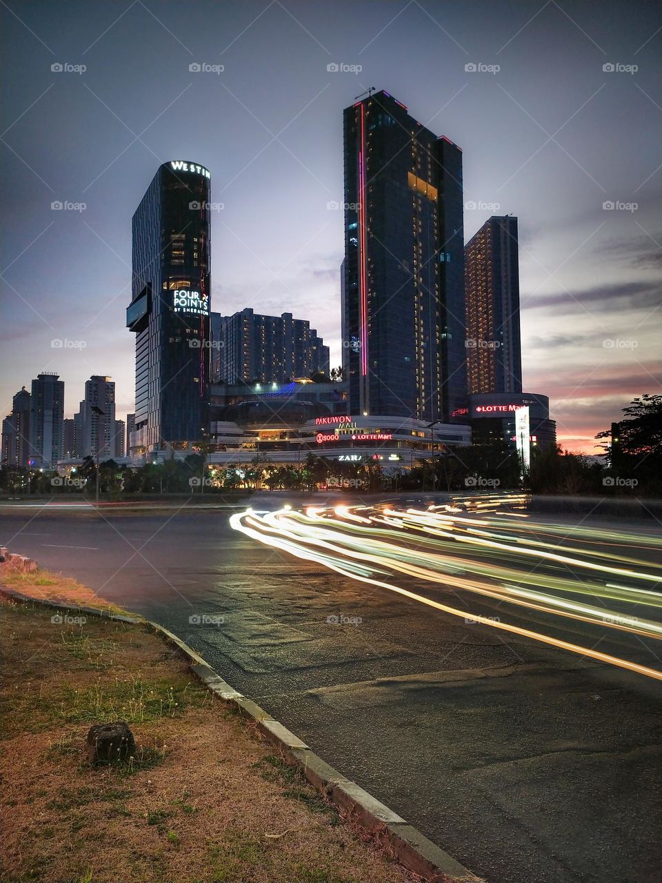 The story of twilight in the corner of the city of Surabaya with its dashing skyscrapers in the province of East Java, Indonesia