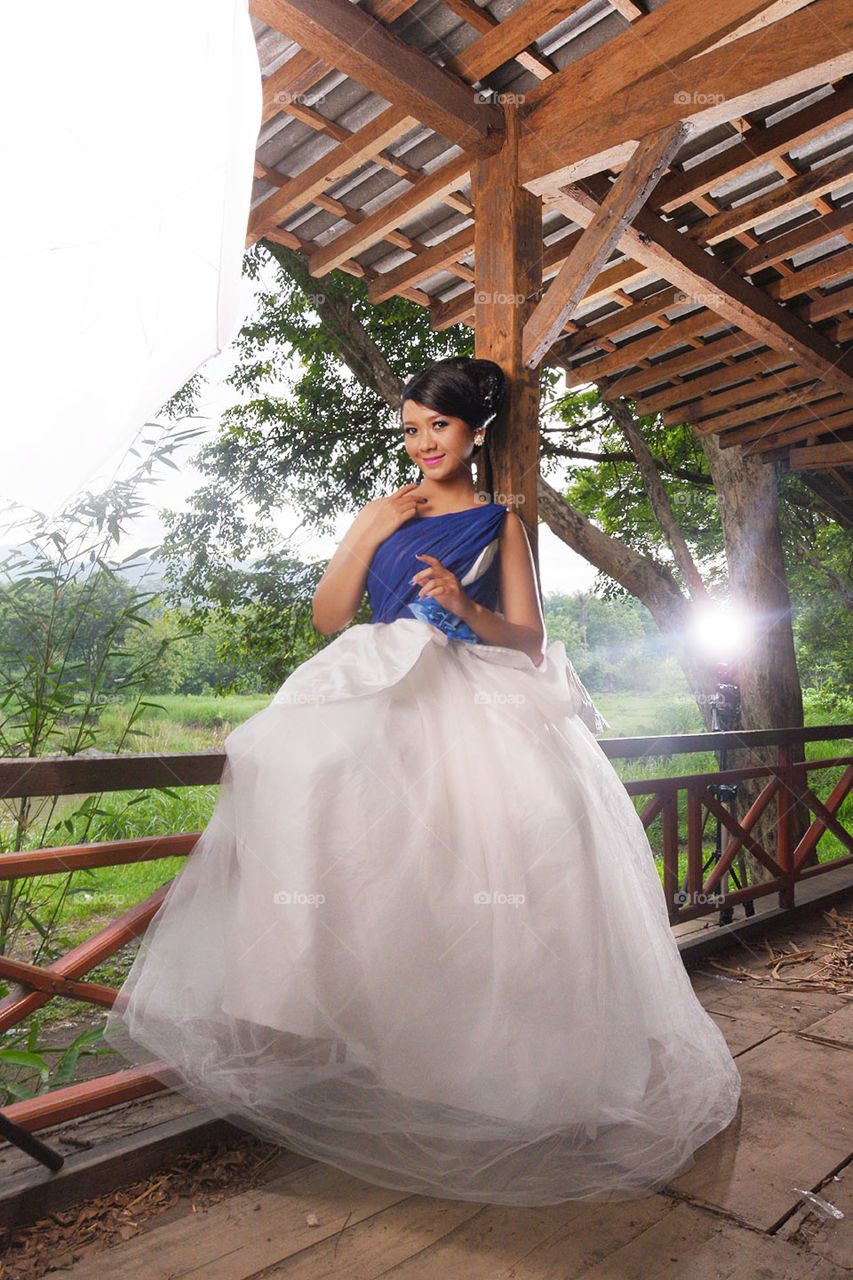 beauty girl with her dress in the garden