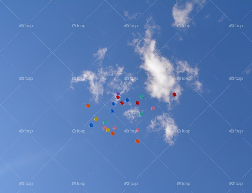 colour balloons in the blue sky clouds