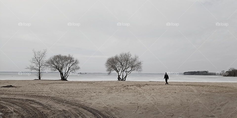 lake shore beautiful nature landscape march and person walking black and white background