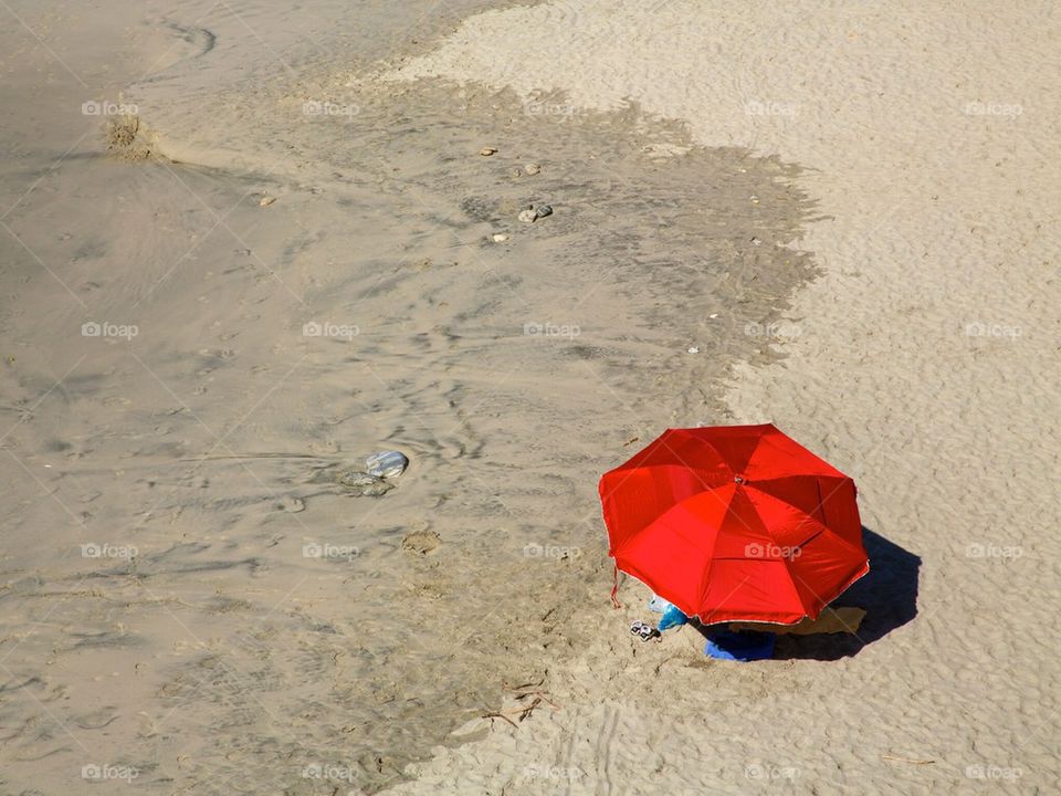 Red Umbrella on Secluded Beach 