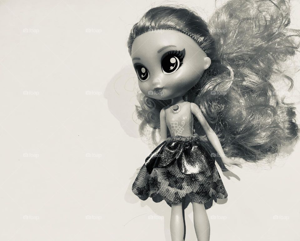 I chose this photo as for me it personally symbolises my desire to go back to a time when one or two dolls were treasured and admired for years to come. The consumerist society we live in for me is a sad one…