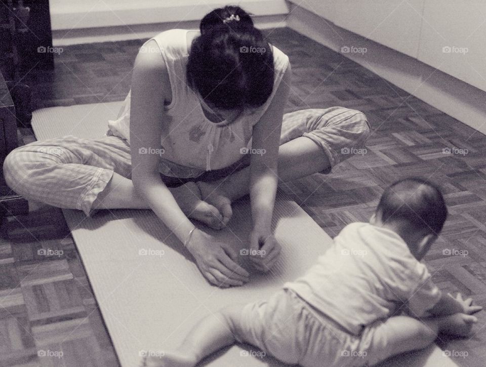 Mother and daughter practicing yoga