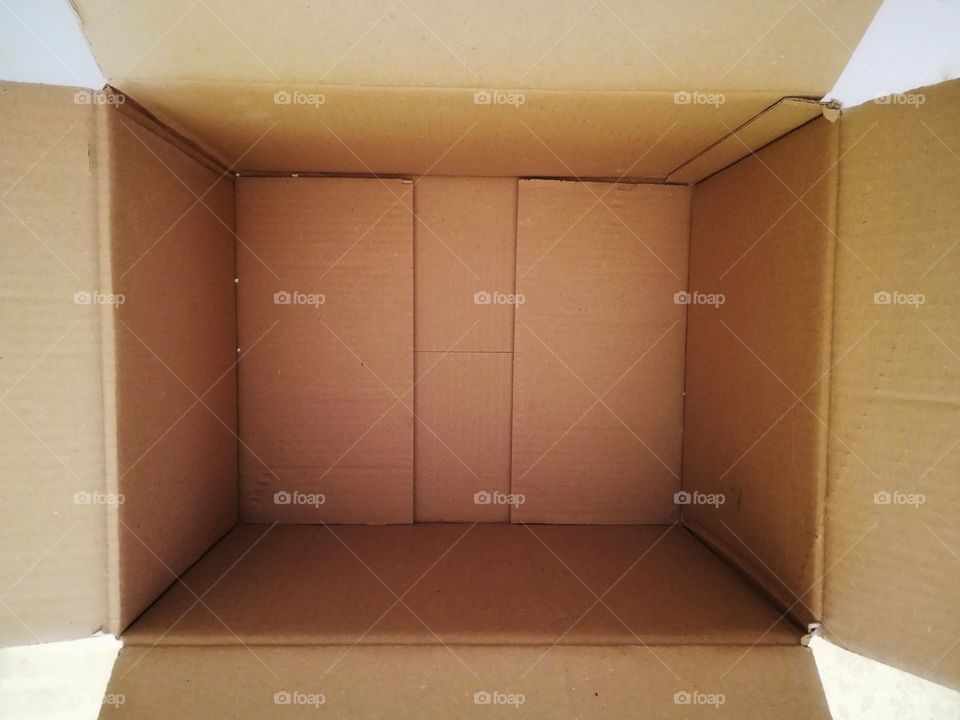 Open cardboard box photographed from above