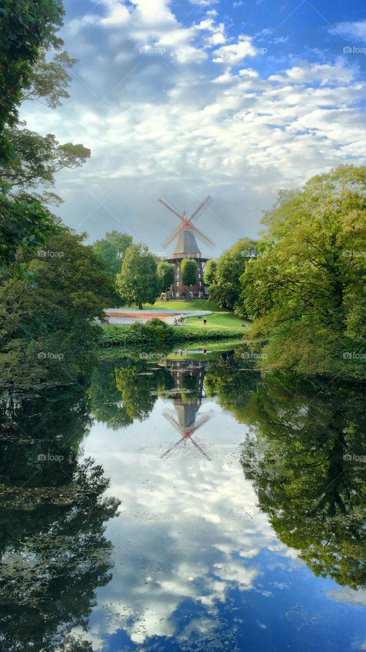 Windmill reflected on lake