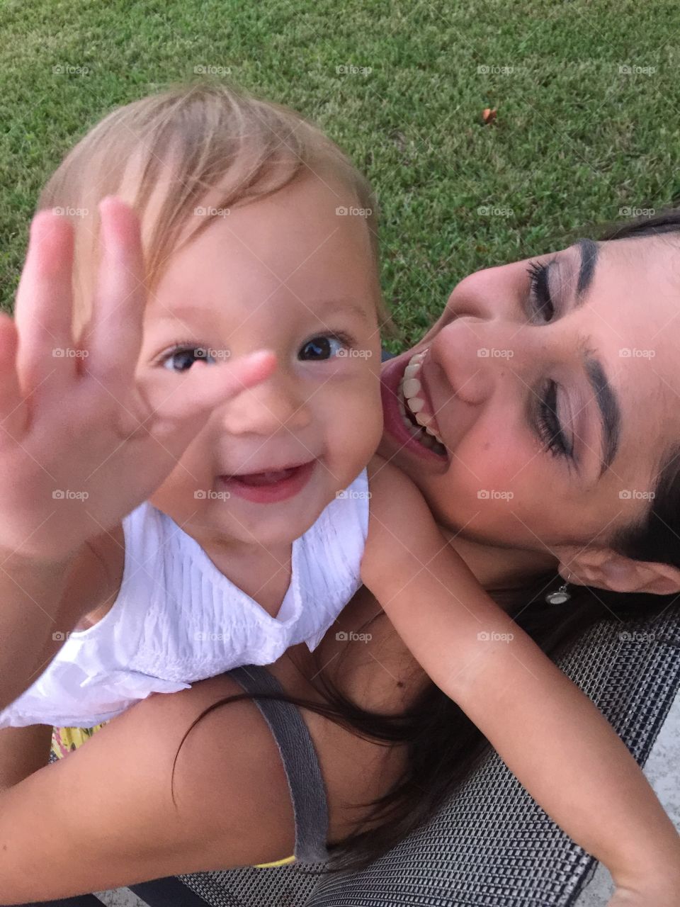 Mother with baby daughter outdoors