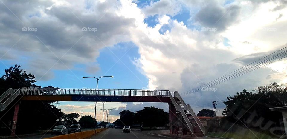 clouds covering the walkway, it looks like an enveloping whirlpool