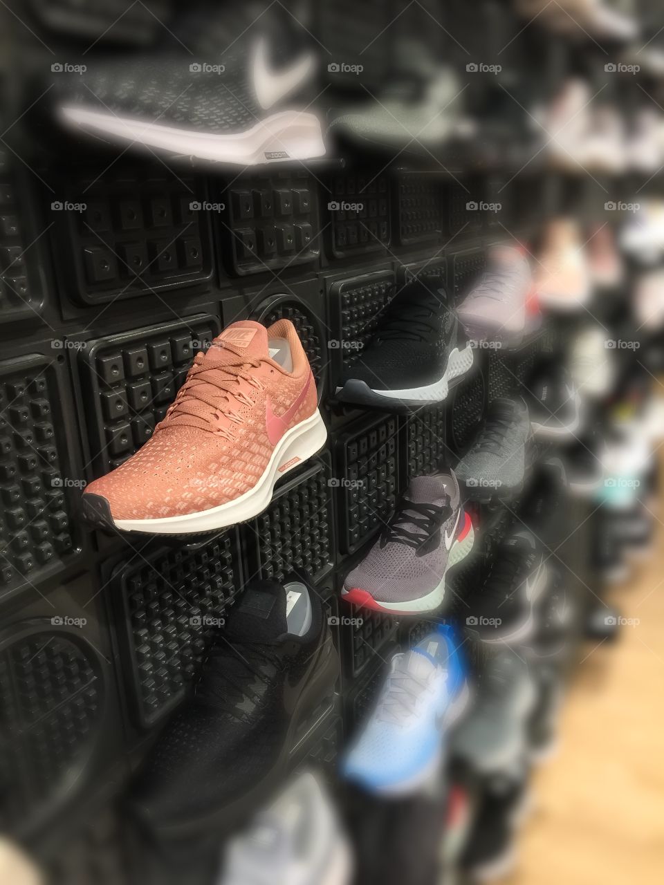 A coloured wall of shoes ready to Just Do It