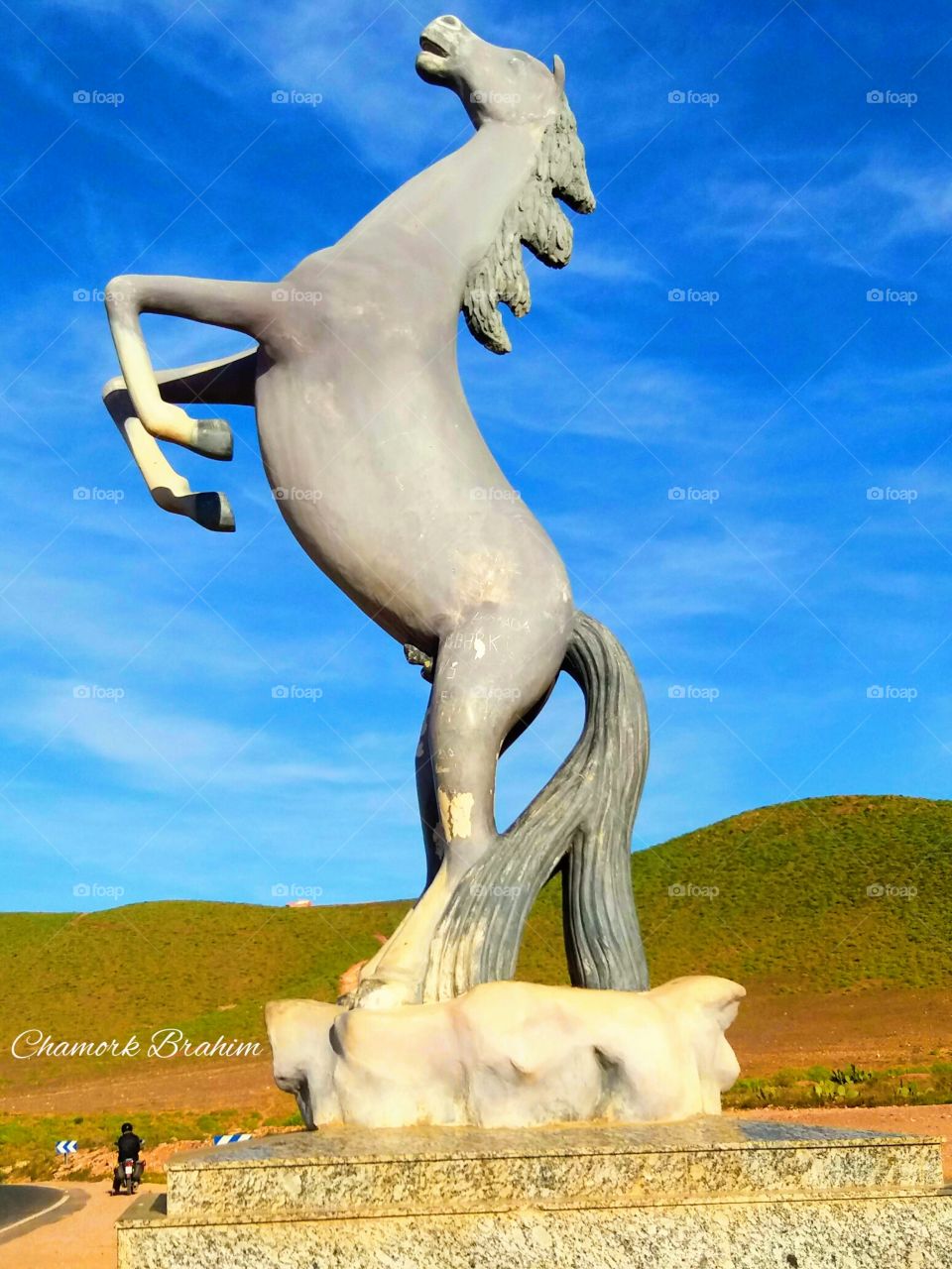 A horse in the entrance of a city called Ifni.It is sooo amazing .people take photos near this amazing statue