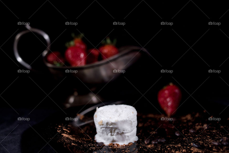Selective view of vanilla ice cream with strawberry