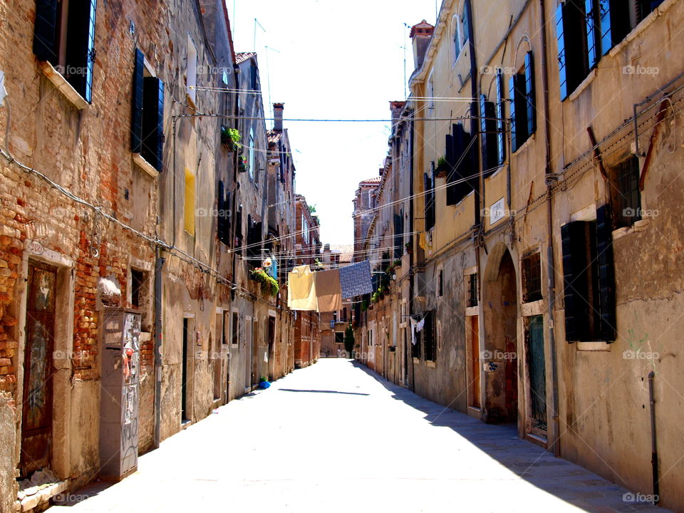 laundry drying in the streets of an Italian town