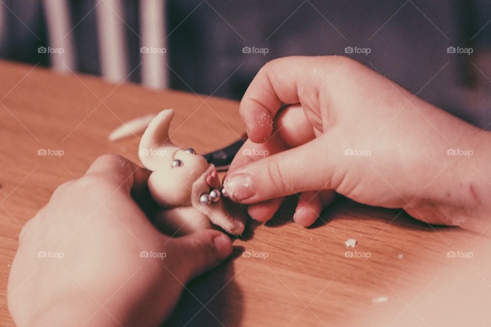 Kid Making a marzipan animal 