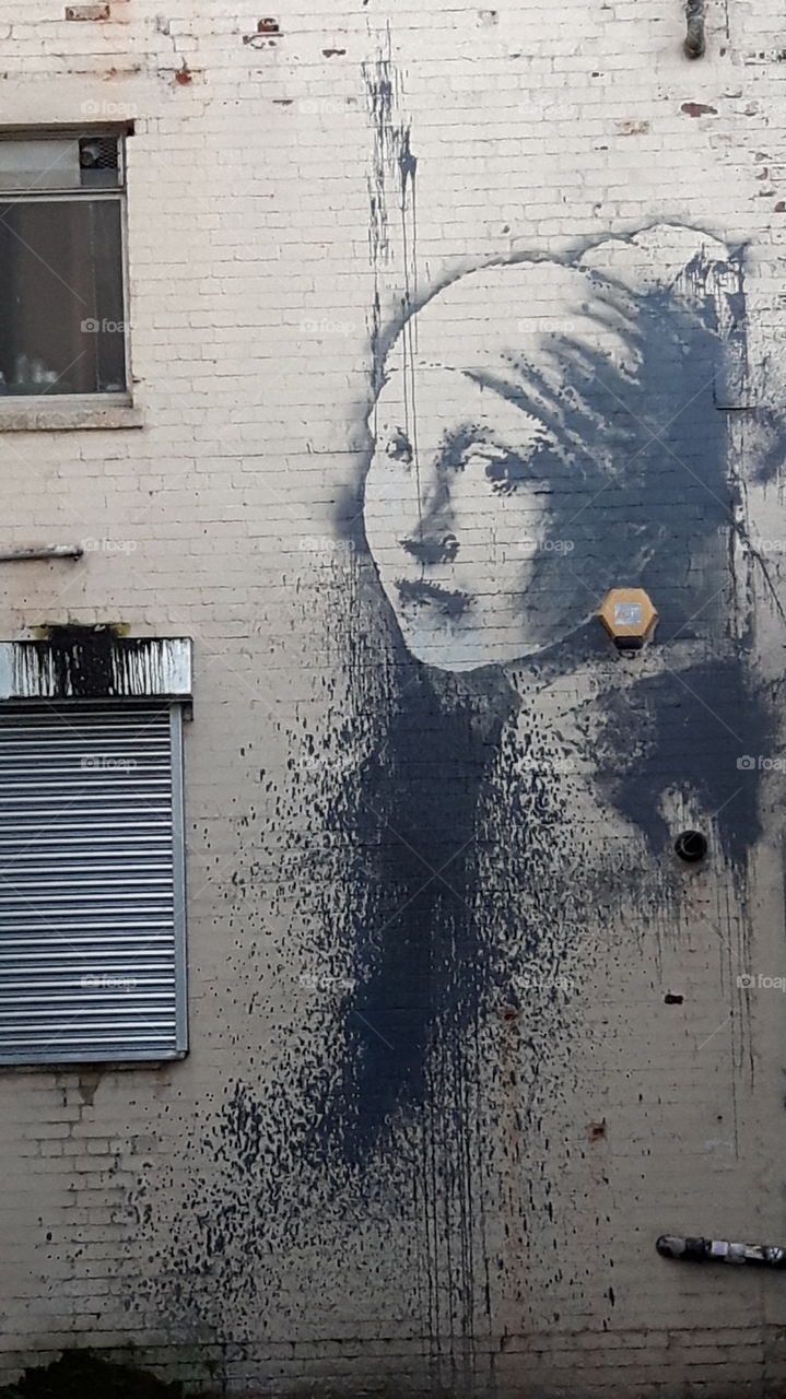 girl with a pearl earring (banksy)