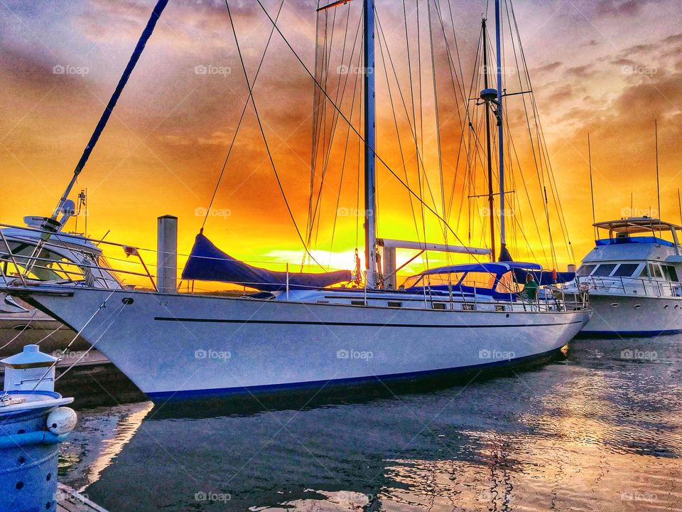 Sunset as backdrop for boats at Ponce Inlet marina