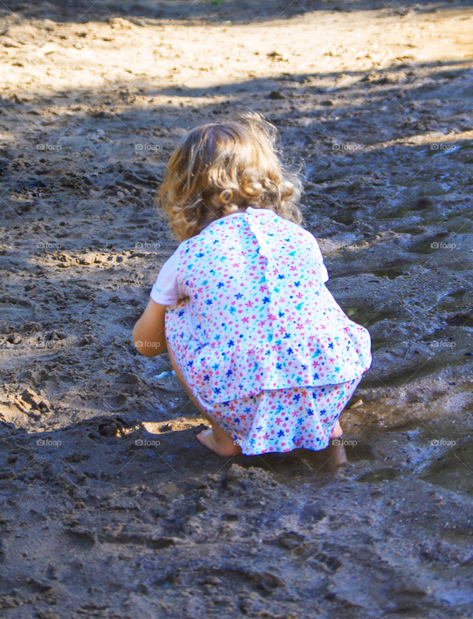 Little girl is walking in the park