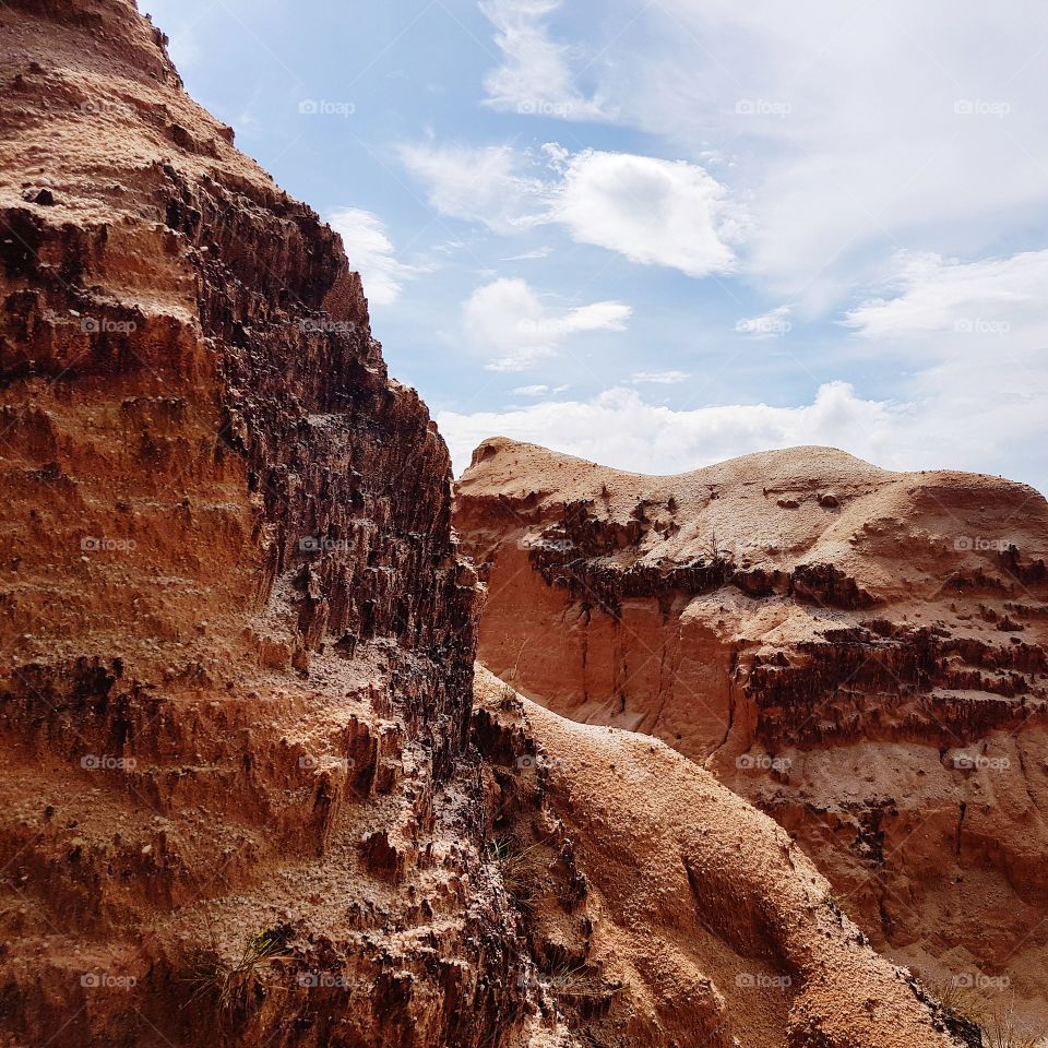 Scenic view of sand dune against sky