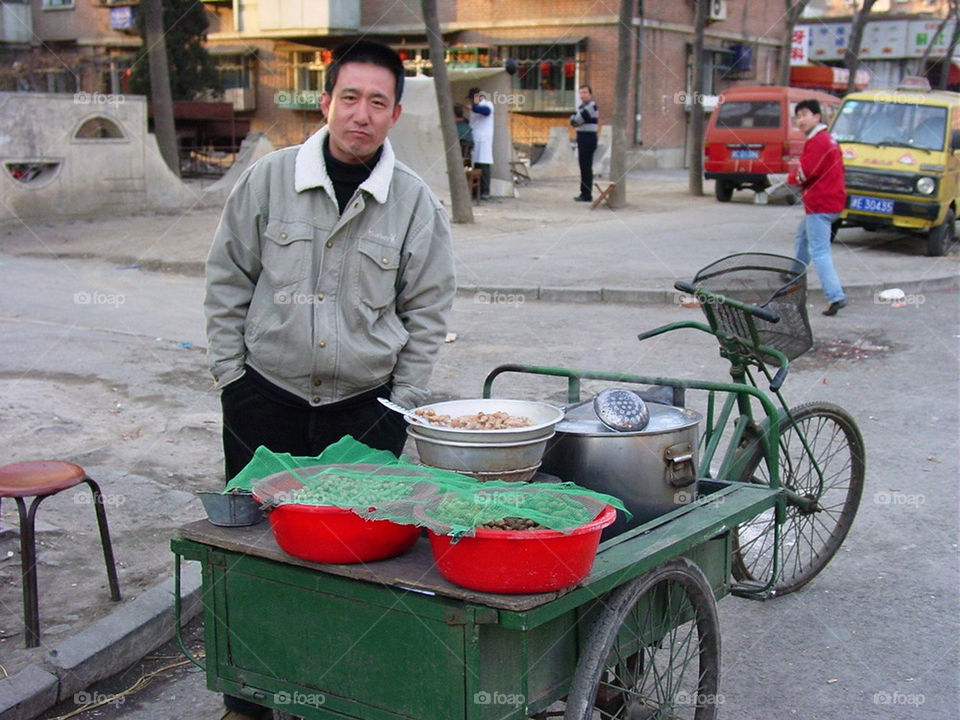 Street vendor selling boiled peanuts