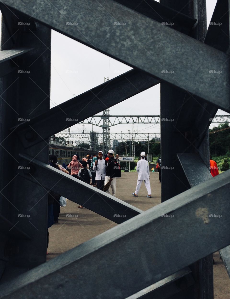 Crowd of people in commuter line railways station in Manggarai, Jakarta, Indonesia. During the celebration of Prophet Muhammad (pbuh), some of Jakartans use the weekend to celebrate the celebration.