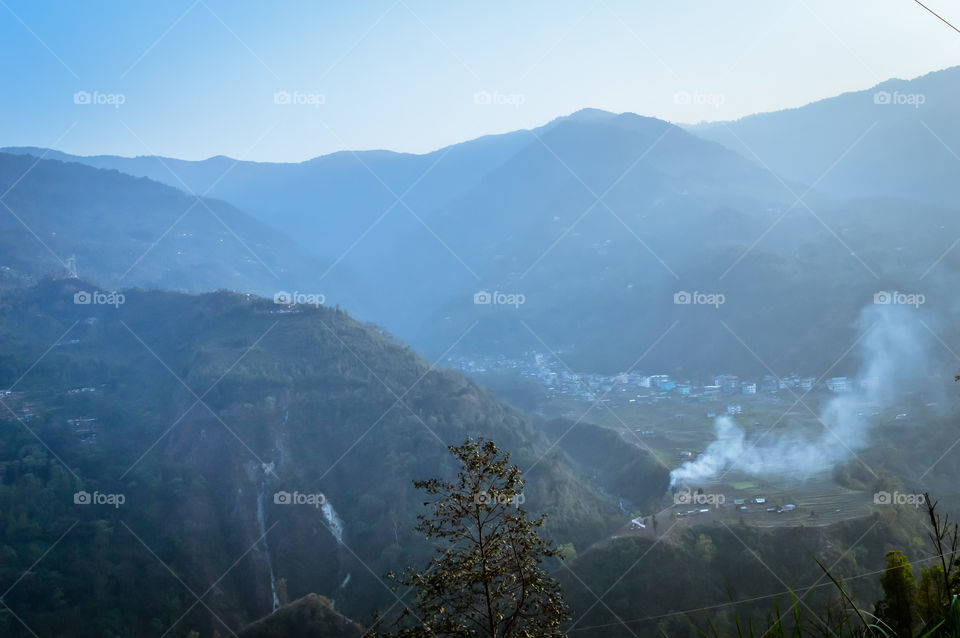 In the jungle to top mountains. Aerial, panoramic view of a forest in the mountains on a foggy day with copy space. Manali, Himachal Pradesh, India