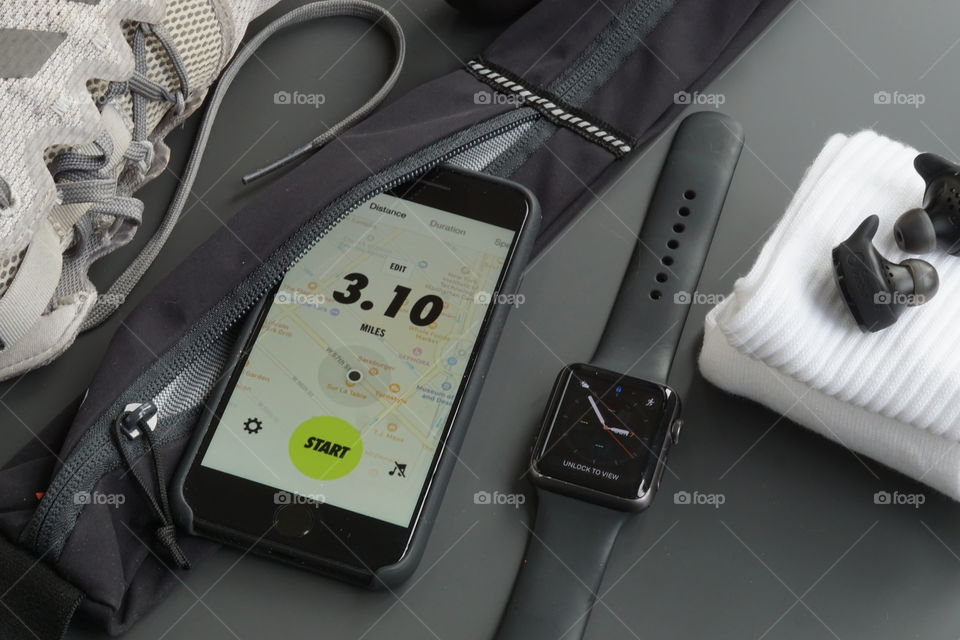 My sons running equipment ... trainers, socks,phone waist strap, mobile/cellphone, ear buds, watch listen to music as you run so GO GO GO and keep fit !