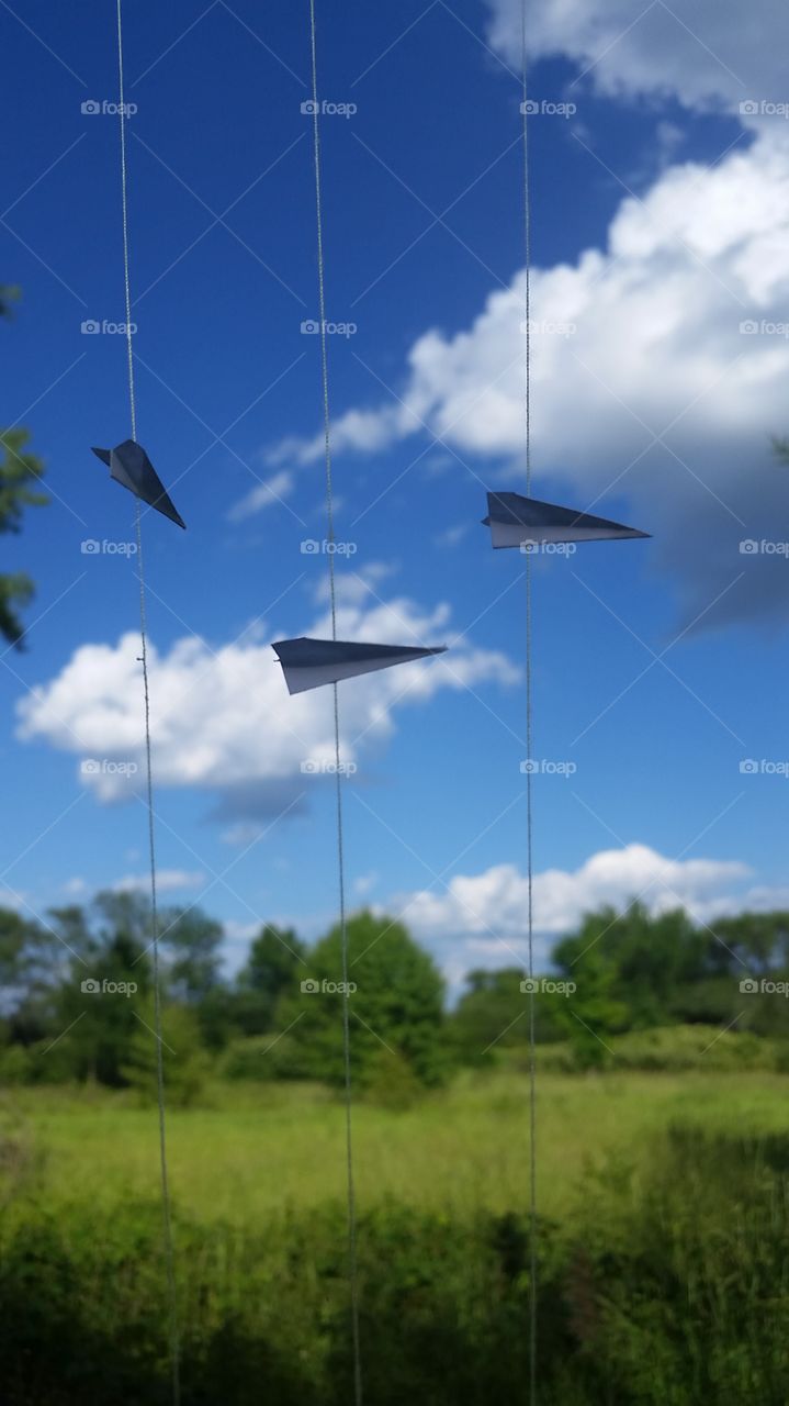 Adventure Is Out There!

3 mini paper airplanes on a string.