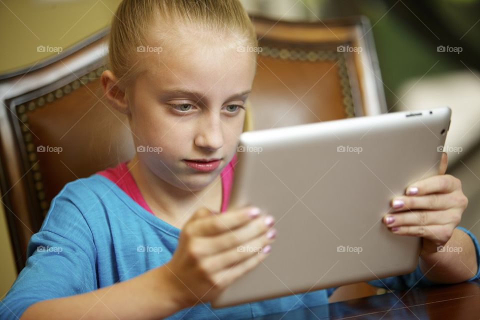 Young girl using tablet computer 