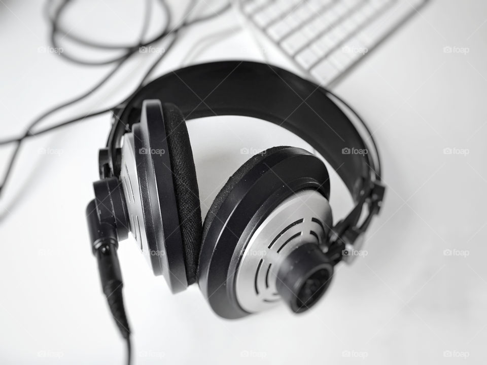 Black and white professional headphones. Selective focus. Music and relaxation concept 
