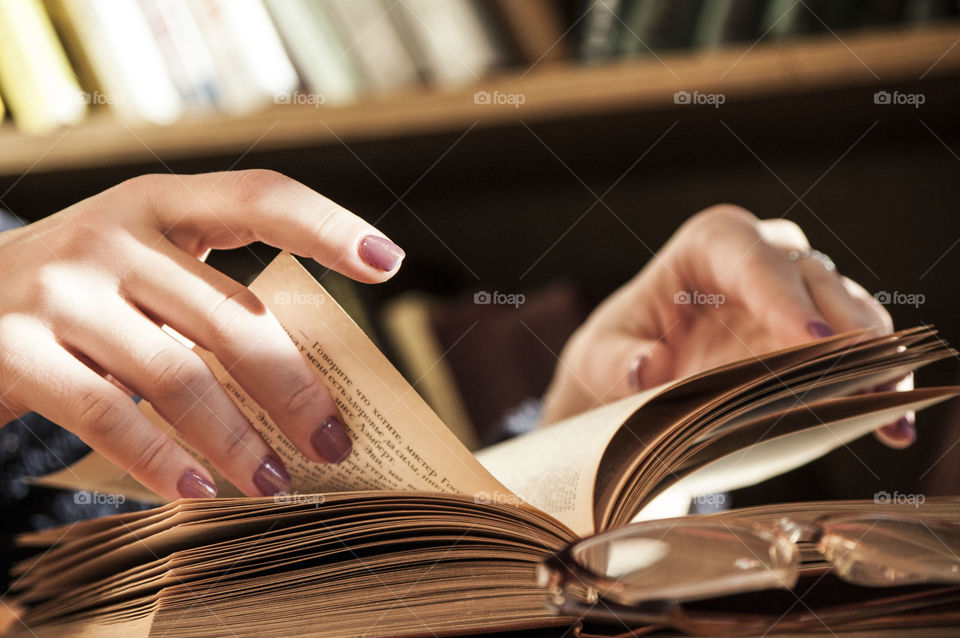 Girl leafing through a book