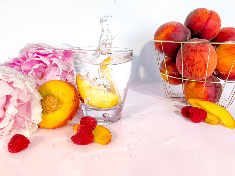 Peach and raspberry water with peonies 