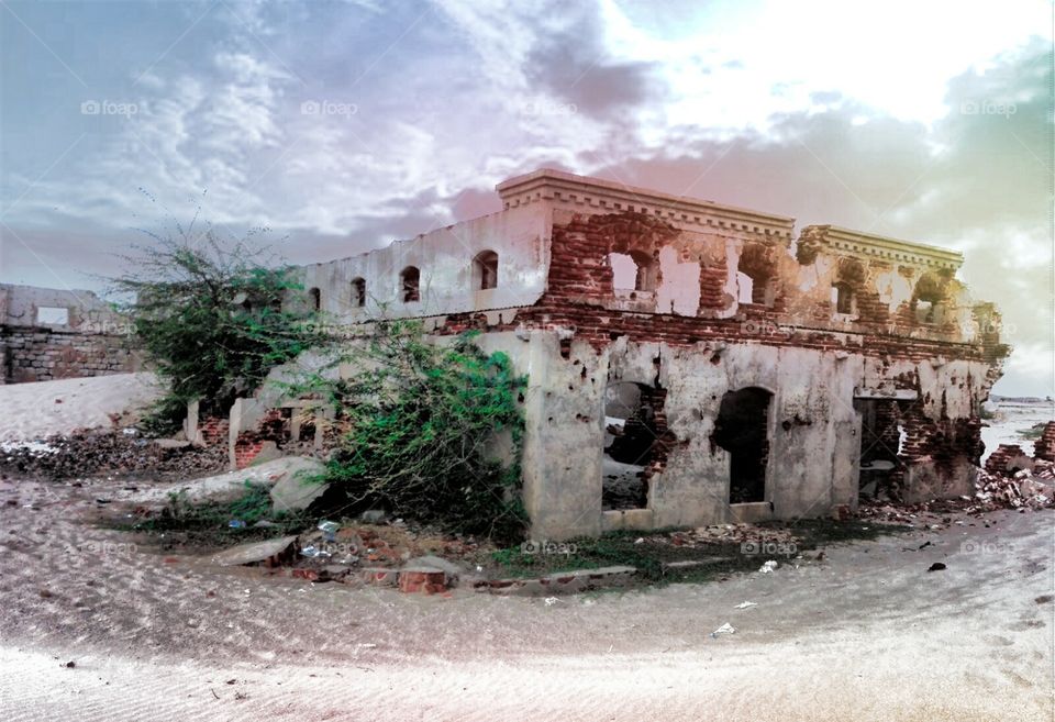 The picture of a ruins of a school in the abandoned town, Dhanushkodi. Located at south-eastern tip of Pamban Island of the state of Tamil Nadu in India. The town was destroyed during the 1964 Rameswaram cyclone and remains uninhabited till date.