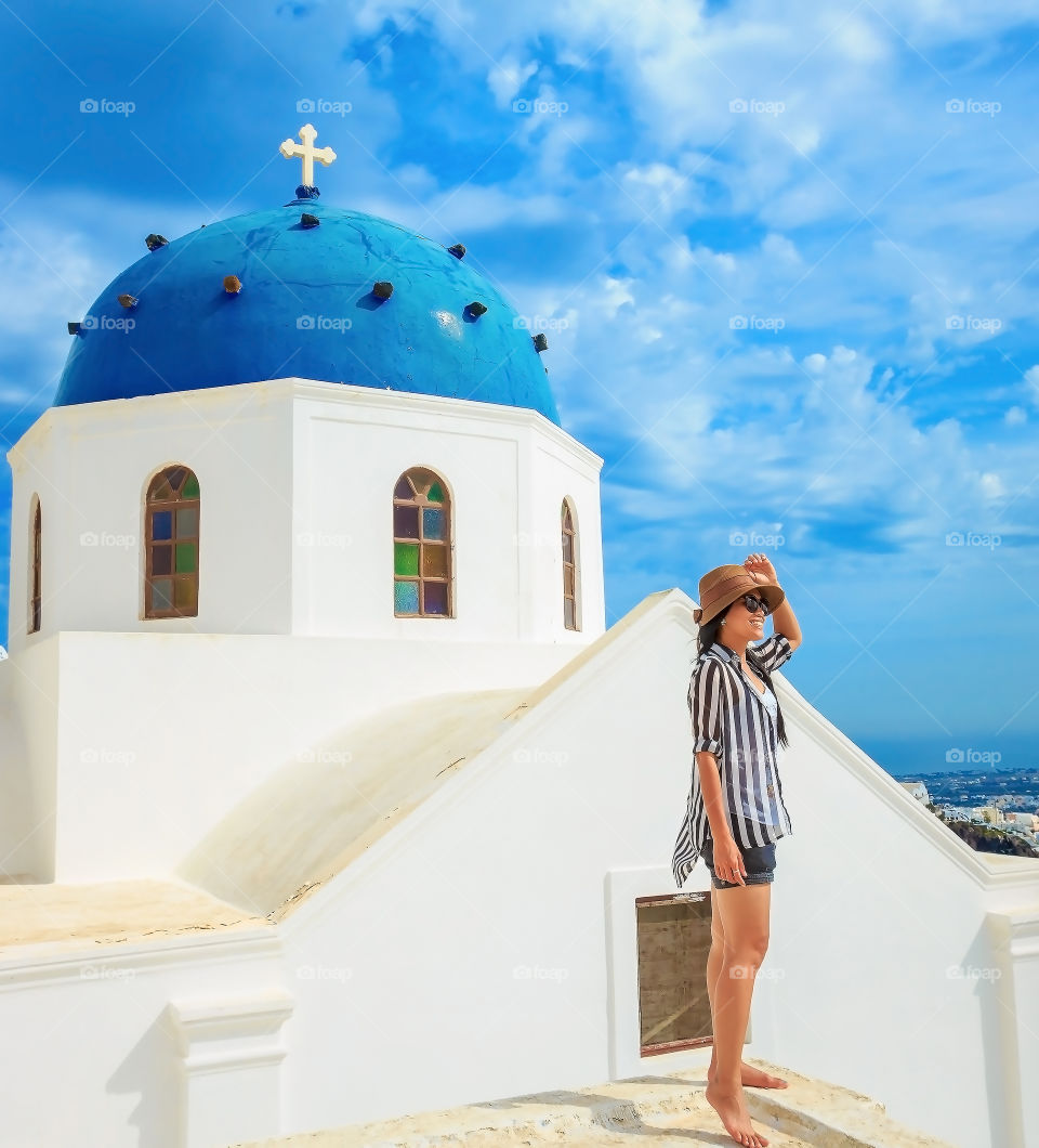 Woman posing near the church, Greece, Santorini