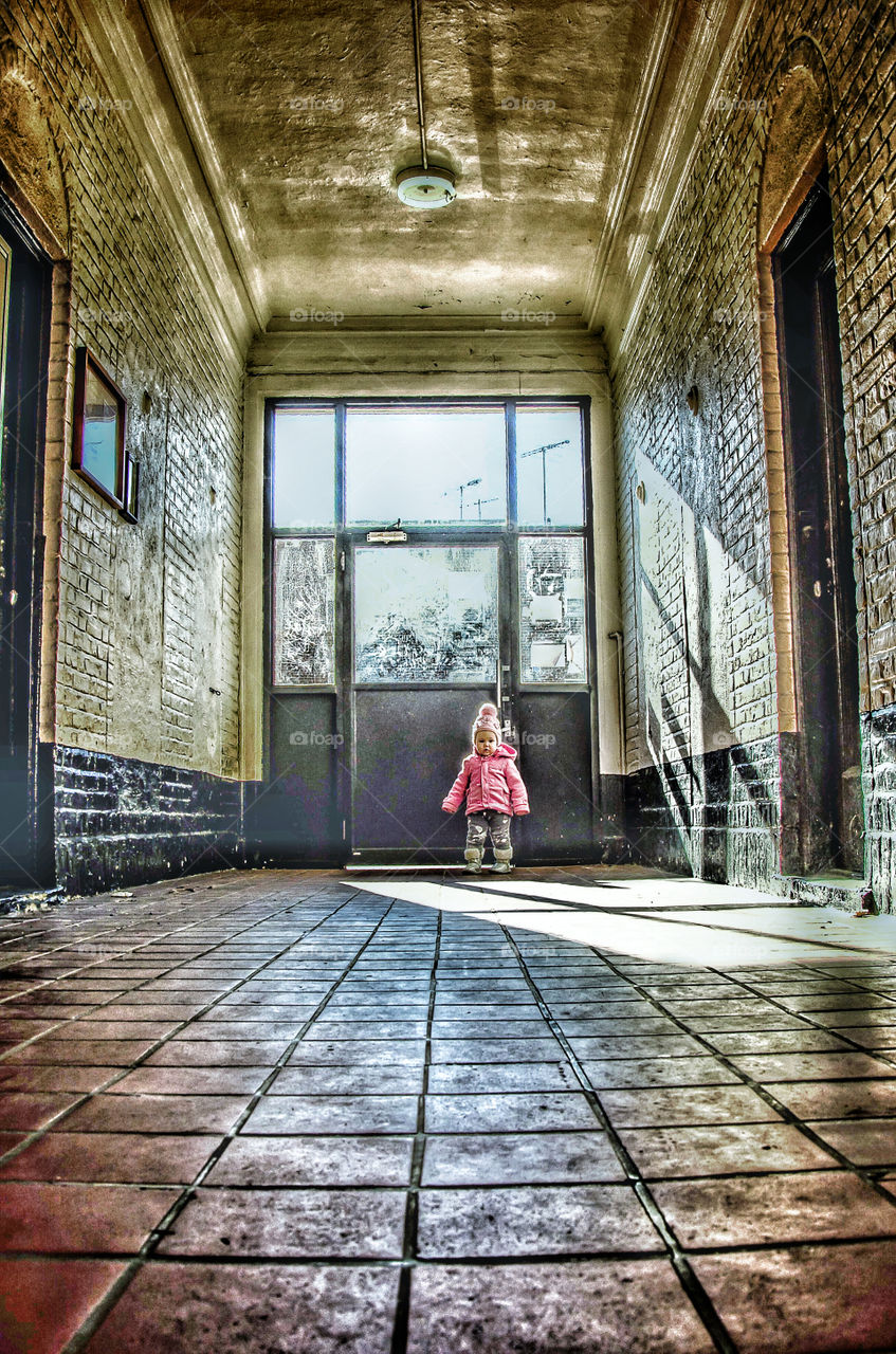 Baby standing in front of door