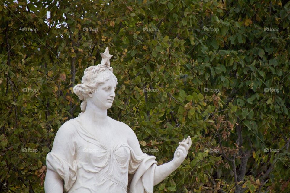 statue of a person in a garden