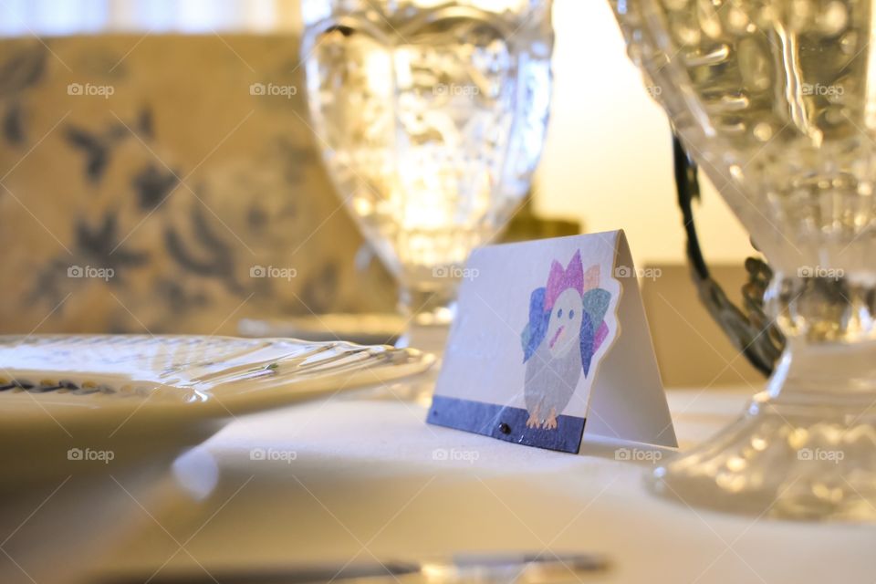 Place card on dinner table set for Thanksgiving holiday feast 